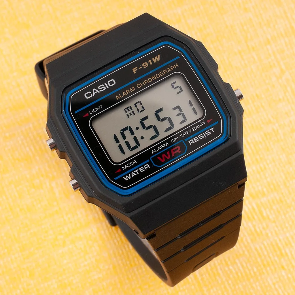 Close-up of a black Casio F-91W resin watch face compatible with the Ollee Watch Bluetooth module
